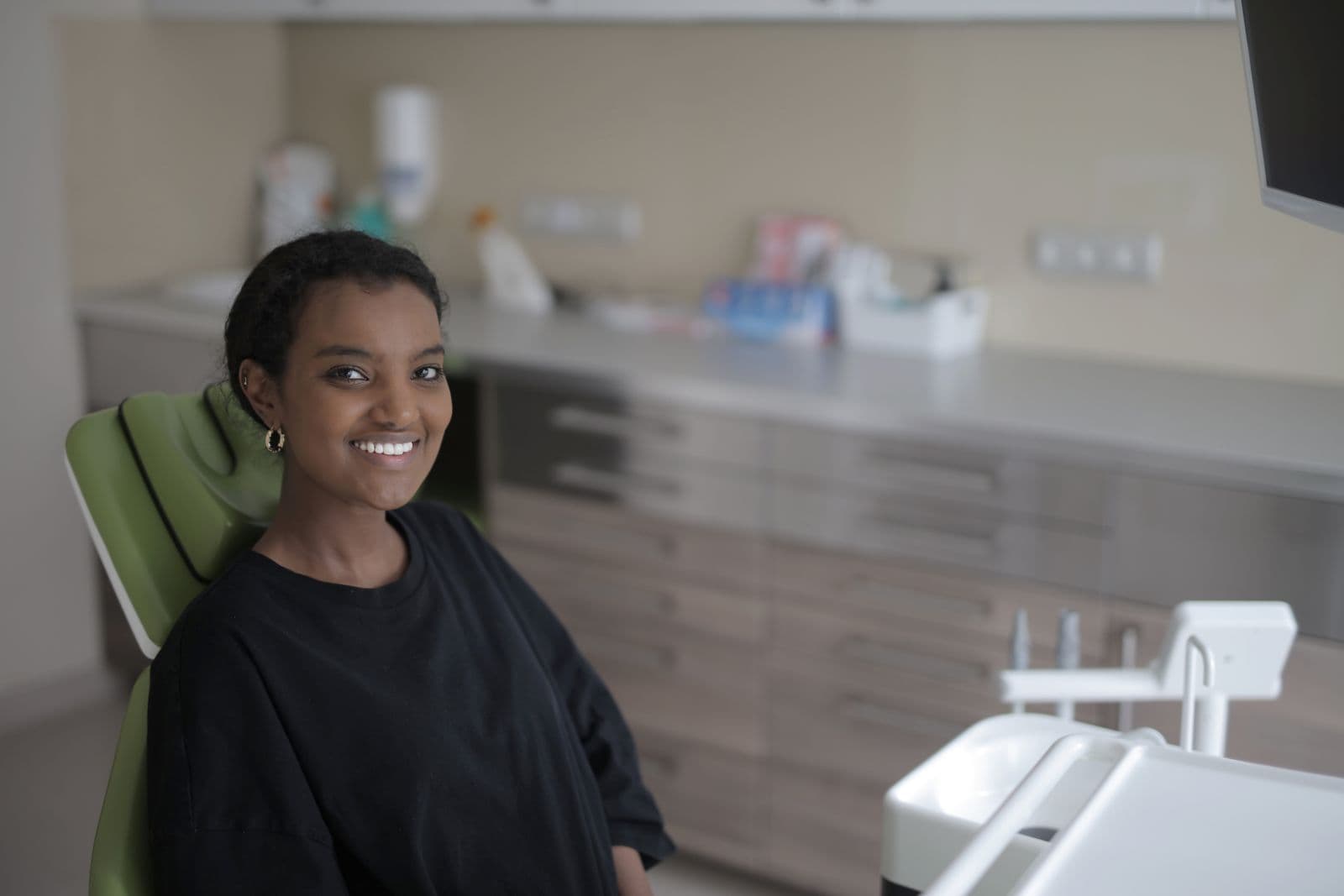 Relaxed patient smiling in the dental chair