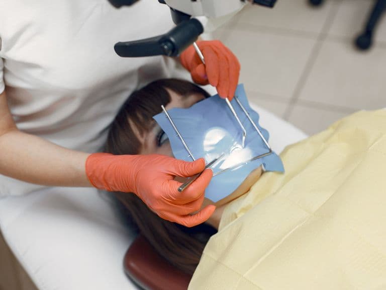 Dentist consulting a patient about crown lengthening treatment