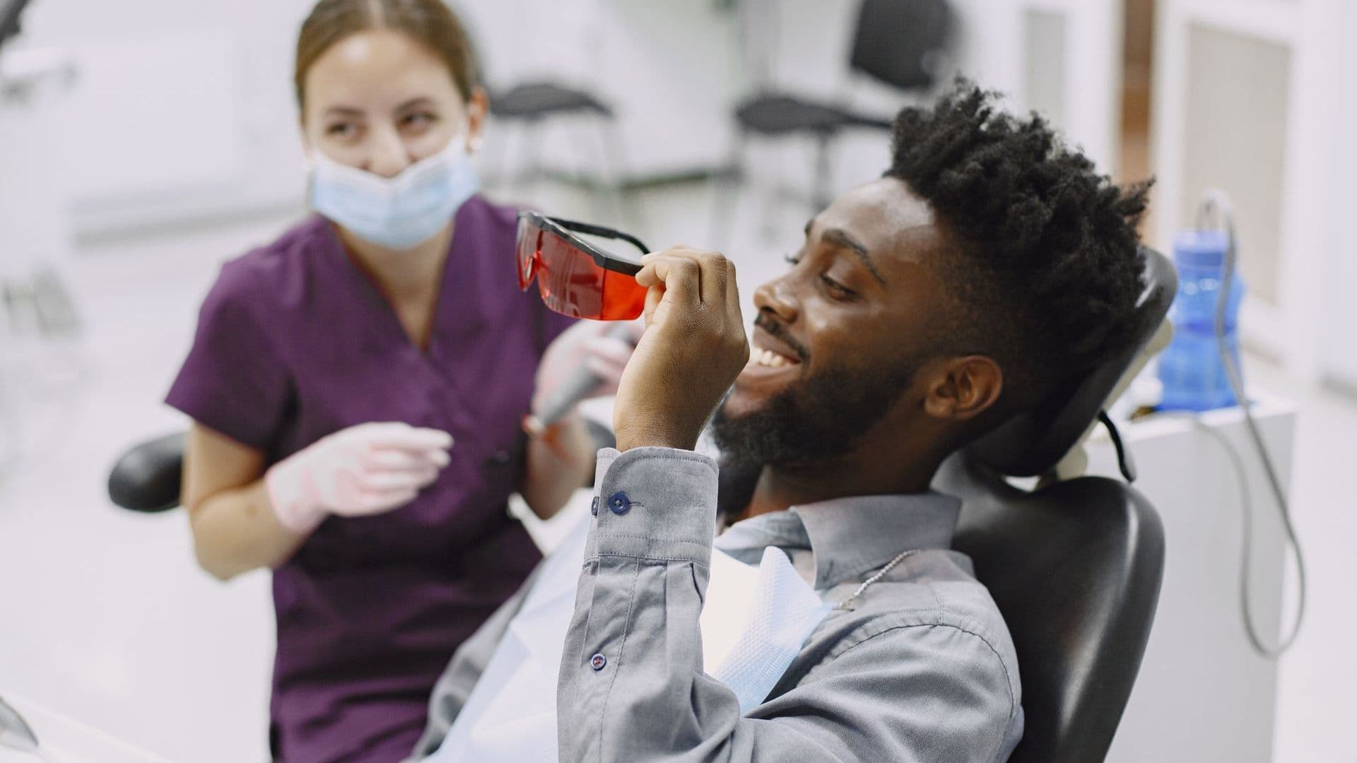 Smiling patient at ease with their dentist