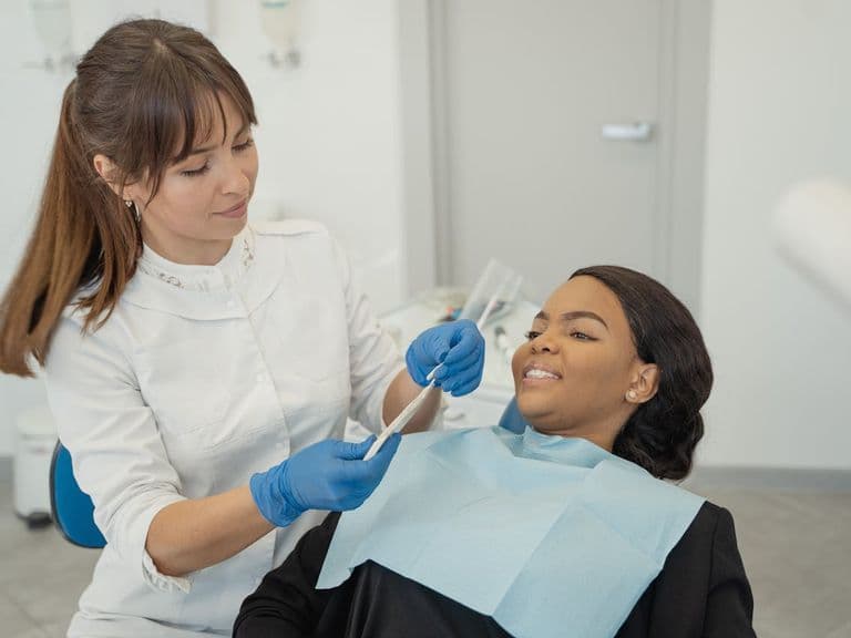 Emergency dental appointment Hatfield. Image of a female dentist treating a female patient.