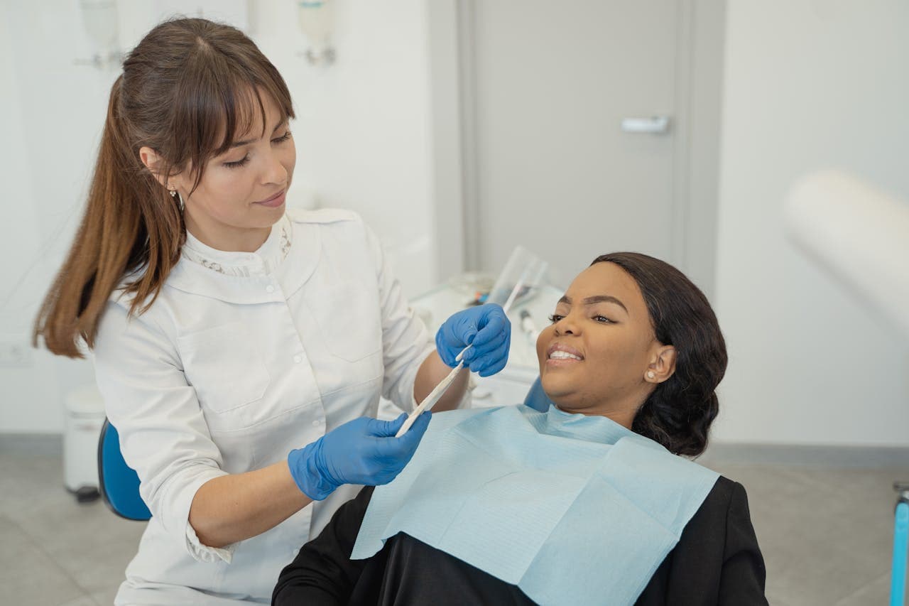 Emergency dental appointment Hatfield. Image of a female dentist treating a female patient.