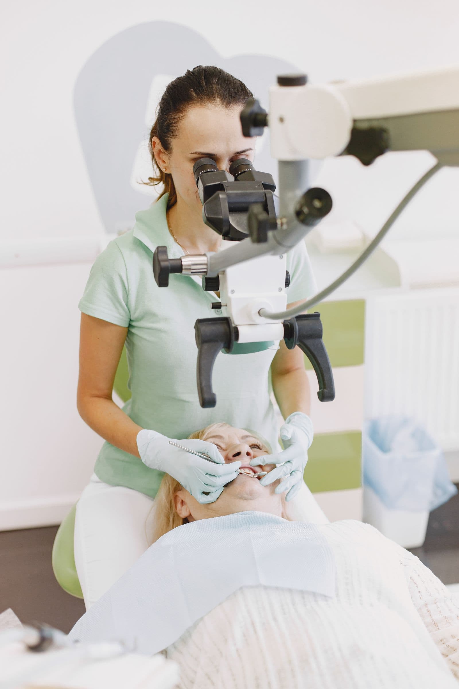 Dentist consulting with a patient about their treatment