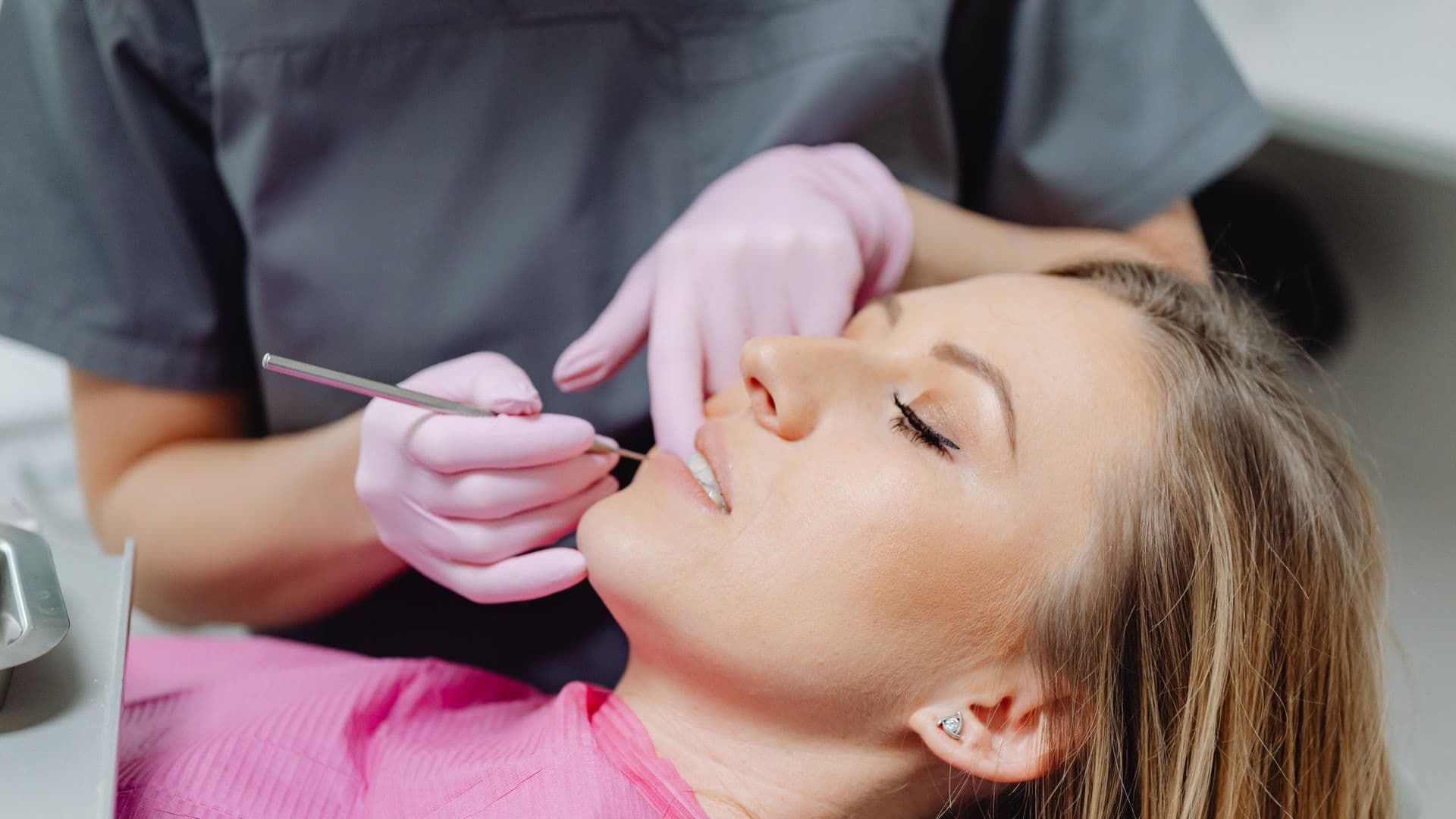 Dentist examining a patient during a same-day dental crown appointment