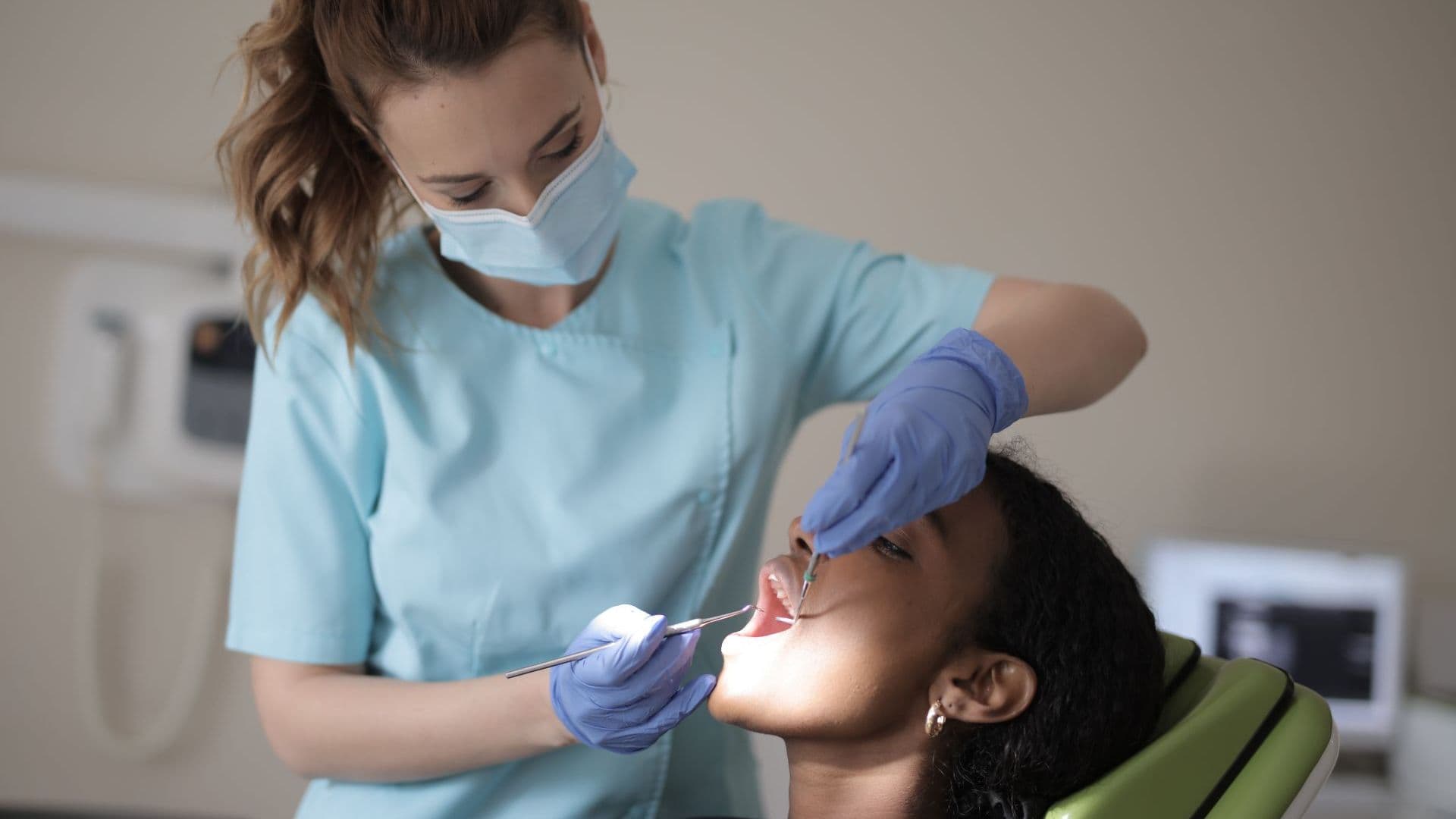 Dentist reassuring a patient before a tooth extraction